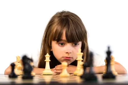 A girl playing chess